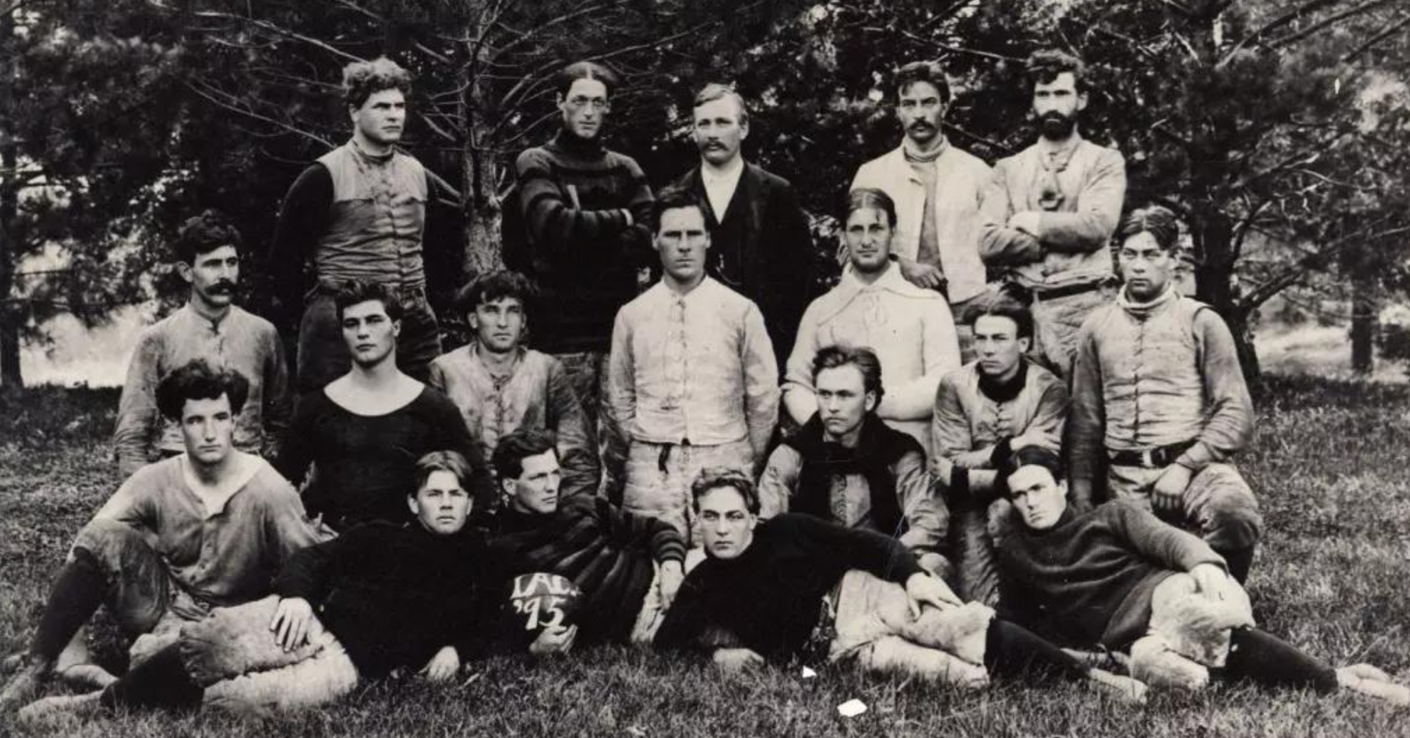 Early Iowa State football team posed outdoors in a historical black-and-white photograph